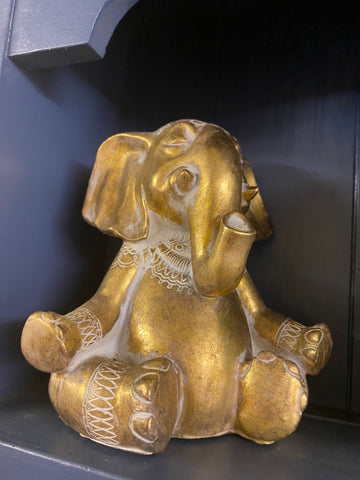 Gold Elephant in peaceful pose